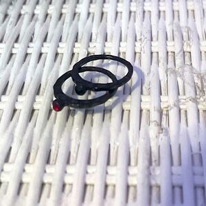 Blacks rings w small gems (red & blue)